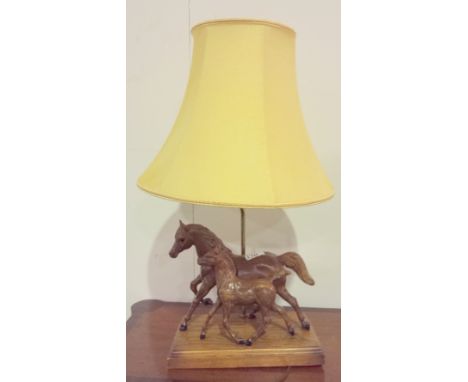 A FIGURAL WOODEN HORSE AND FOAL LAMP. 