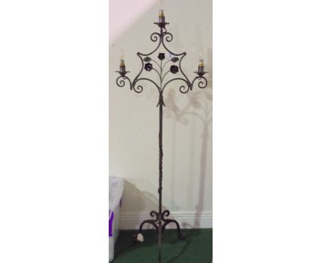 A WROUGHT IRON THREE SCONCE ELECTRIFIED STANDARD LAMP.