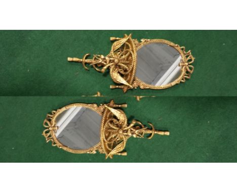 A PAIR OF ANTIQUE ROPE DESIGN GILT OVAL WALL SHELF UNITS, DEPTH 18ins APPROXIMATELY.