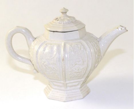 A Staffordshire Saltglazed Stoneware Teapot and Cover, circa 1750, octagonal baluster form moulded with panels of animals and