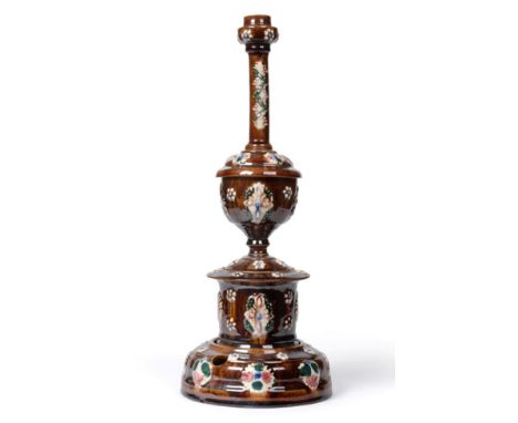 A Measham Bargeware Smoker's Compendium, circa 1890, typically applied with foliage, comprising a candlestick, goblet, tobacc