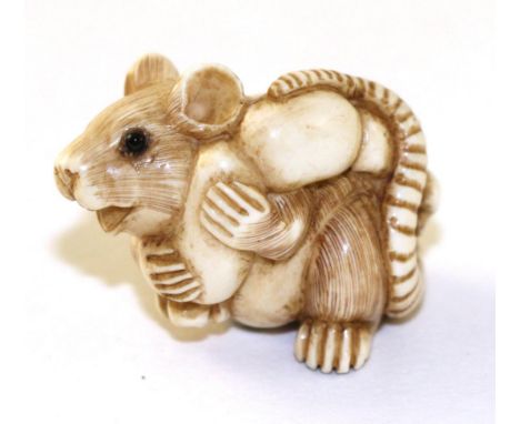 A Japanese Ivory Netsuke, Meiji period, as a rat carrying a gourd on its back, signed, 2.5cm long