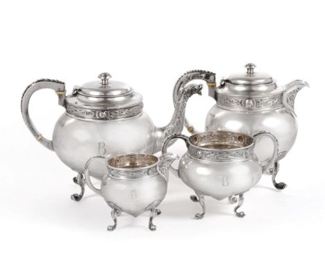 A George V Irish Silver Four Piece Tea Service, Charles Lambe, Dublin 1921, of circular form with chased and engraved Celtic 