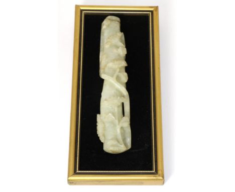 A Chinese Jade Handle, worked in relief with flowering branches, 16.5cm longBroken in half and reglued.  Some surface scratch