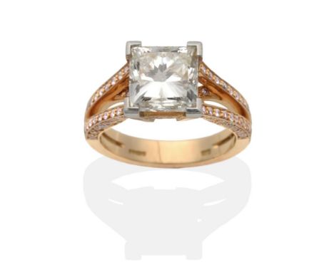 An 18 Carat Rose Gold Princess Cut Diamond Solitaire Ring, by Boodles, in a white claw setting, to pink diamond set rose-colo