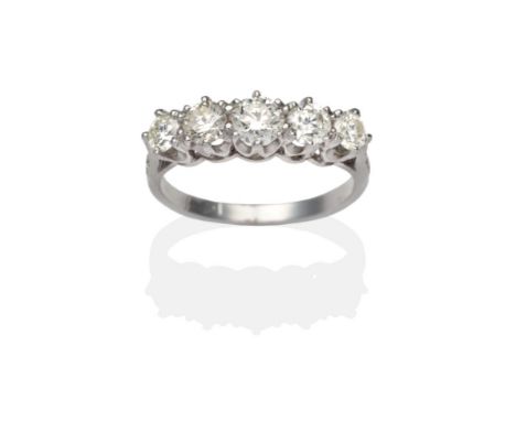 A Diamond Five Stone Ring, graduated round brilliant cut diamonds in white claw settings, to diamond set knife edge shoulders