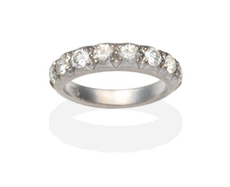 A Diamond Half Hoop Ring, eight round brilliant cut diamonds in white collet and claw settings, on a plain polished shank, to