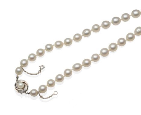 A Cultured South Sea Pearl Necklace, a strand of 41 off-round cultured pearls knotted to a white scroll clasp, set centrally 