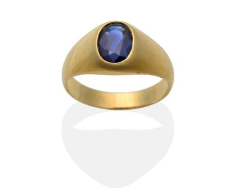 A Sapphire Signet Ring, an oval cut sapphire inset to a yellow tapering mount, on a plain polished shank, finger size V see i