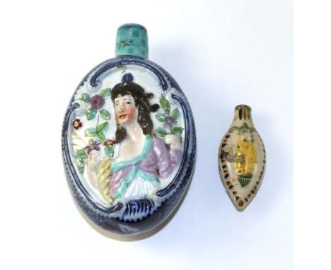 A Pearlware Flask, circa 1800, of oval form, moulded and painted with busts of Ceres holding a cornucopia on a scale blue gro