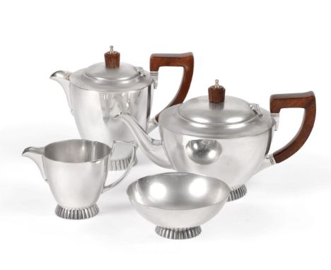 An Elizabeth II Four Piece Silver Tea Service, Wakely & Wheeler, London 1972, circular on fluted foot, the teapot and hot wat