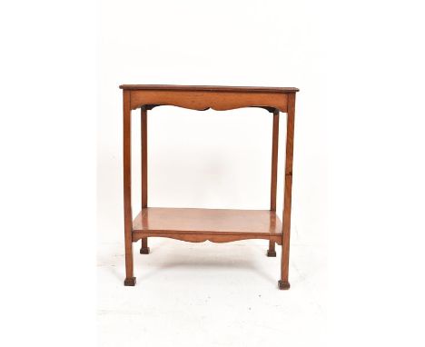 Late 19th/ early 20th century mahogany arts and crafts table standing on four squared legs with tiered shelf beneath of oblon