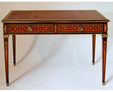 A good quality 20th century reproduction Louis style writing table, straight tapering legs, parquetry inlay to the  drawers, 