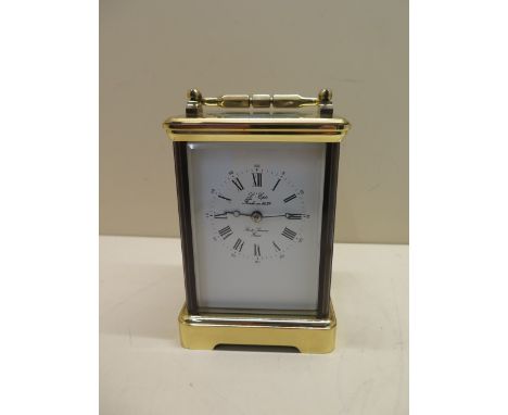 A good quality French 20th century carriage clock, striking on one gong, 15cm tall, with handle down, in good condition and r