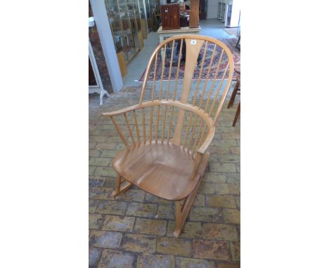An Ercol light elm rocking chair in good condition