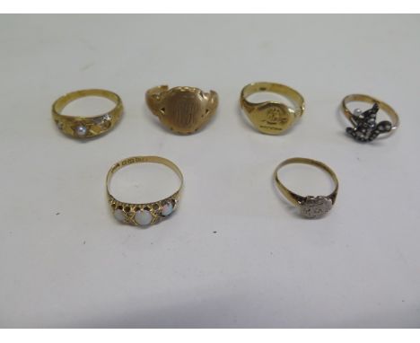 Five 18ct gold rings and a part ring, tests to approx 18ct, one ring missing a pearl, some bending to others apart from signe