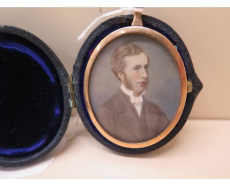 A portrait miniature of a Victorian gentleman in a gilt metal oval frame and velvet lined leather case, 5cm high, together wi