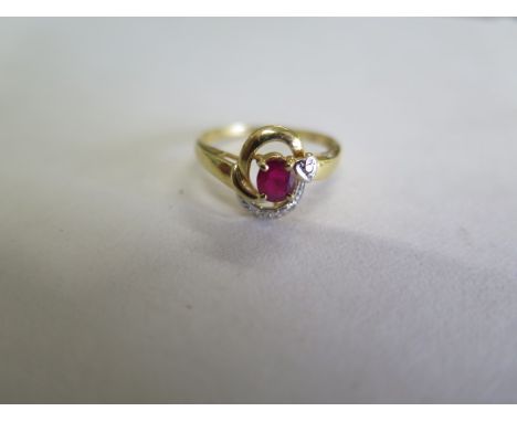 An 18ct yellow gold ruby and diamond ring, ring size L, approx 1.8 grams, in generally good condition with some minor wear 
