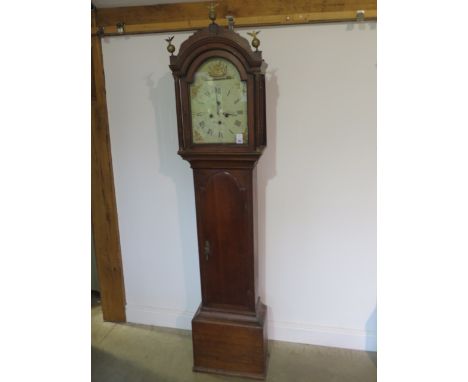 A 19th century 8 day longcase clock with a painted arched dial with second hand and calander, signed W Flint, in an oak case 