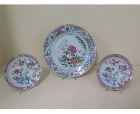 A pair of  famille rose saucers and a plate, saucers 13cm diameter, plate 22cm diameter, all in good condition apart from min