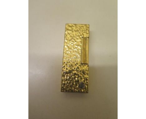 A gold plated Dunhill gas lighter, generally good and strikes 