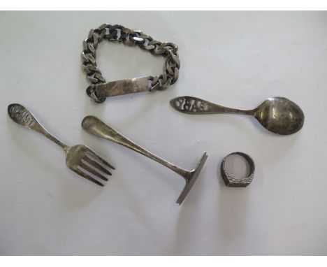 A silver ring, bracelet, pusher and spoon and fork, total weight 3.3 troy oz 