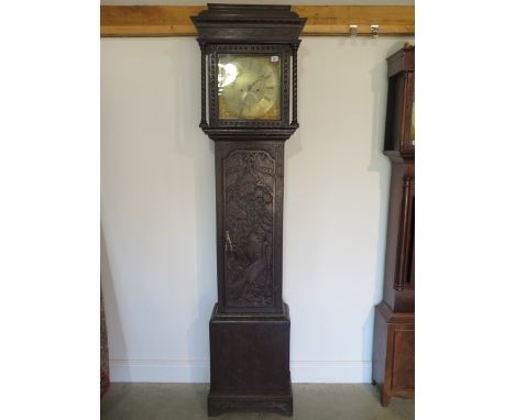 An early 19th century longcase clock, James Hunt of Bradford 1211, brass dial 8 day movement oak case with later carving, 218