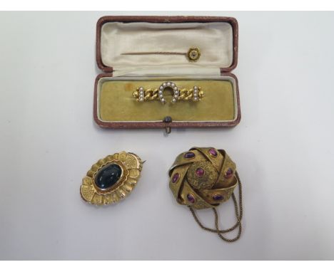 A pair of gilt metal brooches, approx 19 grams, a pin marked 15ct, approx 1 gram and a gold and pearl memorial brooch, approx