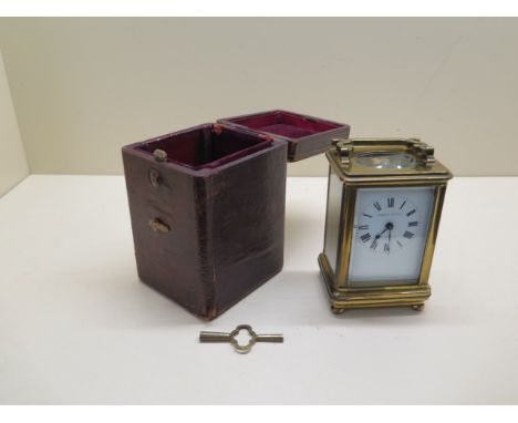 A French brass carriage clock by Robert Sawers, Edingburgh, 12.5cm high with travel case, running in saleroom 