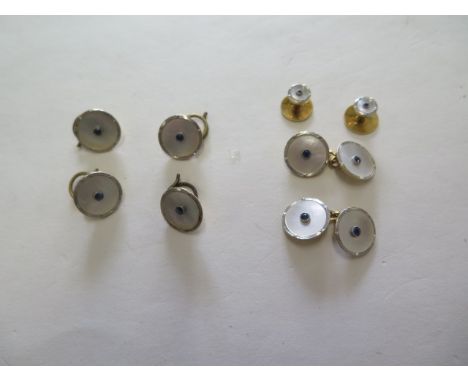A set of 18ct gold, platinum mother of pearl and sapphire waistcoat buttons, cufflinks, and shirt studs with base metal clips