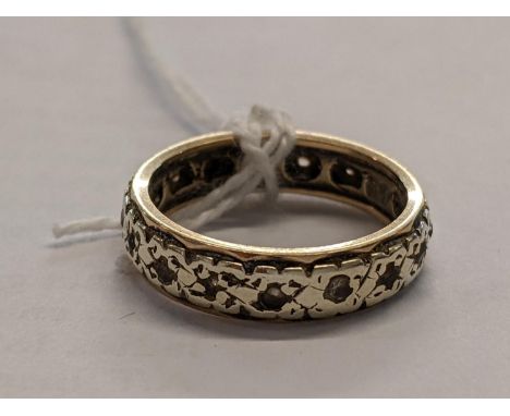 A yellow and white metal eternity band with small white stones, total weight 3.21gLocation: RING 