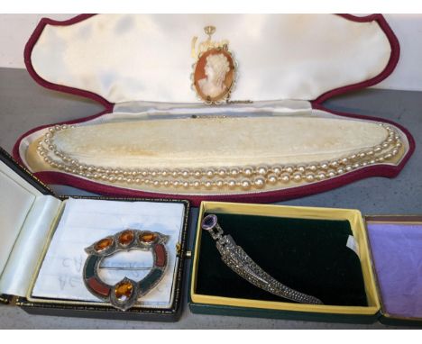 A Scottish silver coloured brooch, a brooch fashioned as a dagger, a double string of faux pearls and a rolled gold cameo bro