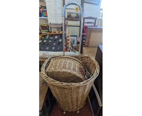 A wicker hamper with contents and a wicker trolley Location: 