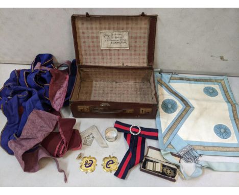 Masonic regalia to include an enamelled napkin ring, a medal stamped silver, silver plate and gilt enamelled items, aprons co