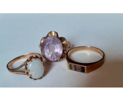 A 9ct gold ring with amethyst coloured cabochon in a contemporary floral mount, total weight 3.21g together with a 9ct gold a