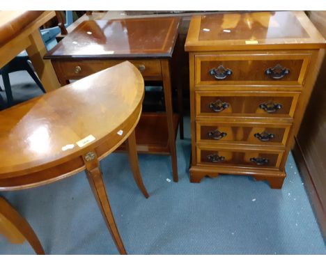 Three small items of furniture to include a yew chest of four drawers, a demi-lune table and a two tier lamp tableLocation: 