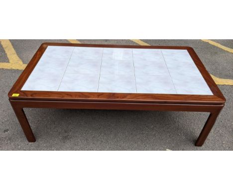 A vintage mahogany and tile topped coffee table Location: 