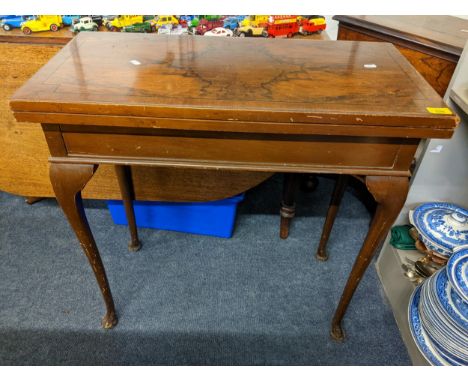 An early 20th century walnut fold over card table, 76cm h x 76.5cm wLocation: 