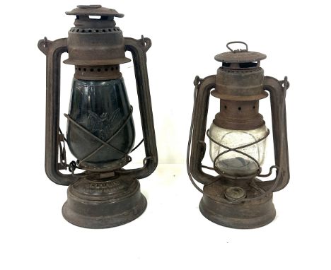 Two vintage tilly lamps one marked Gremlin with a bat impression