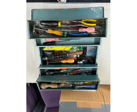 Metal tool box with a large selection of assorted tools