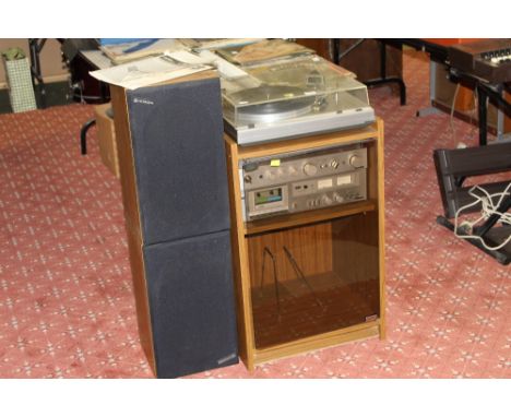 A 1980's walnut effect music cabinet containing Hitachi model HT/ 324MK2 turn table, Hitachi AMFM studio receiver model SR- 2