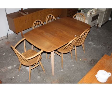 An Ercol blond elm dining table with 2 extra leaves with lacking hinges and bolts, 72 cm high x 262 cm extended x 90 cm wide 