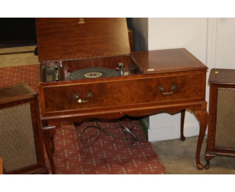 A Dinetron SRX26 radiogram, contained in a mahogany and veneer case, later fitted with gold ring lencogl 72 turntable 98 cm w