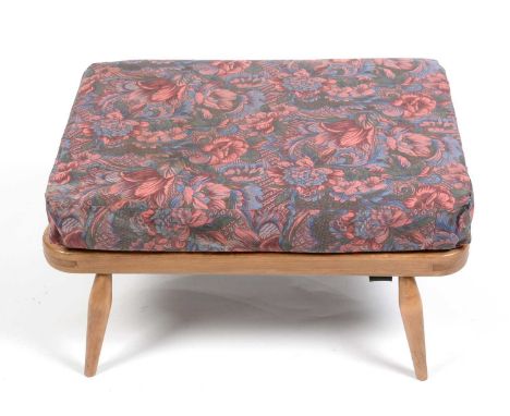Ercol; a beech Windsor Model 341 extension stool, associated cushion, 70 x 51 x 34cms.