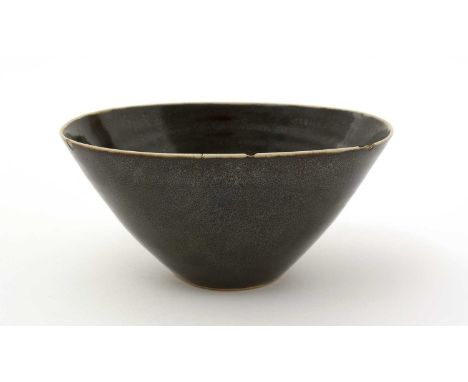 Dame Lucie Rie (1902-1995) and Hans Coper (1920-1981). An oval stoneware bowl with dark brown glaze with white rim and inner 