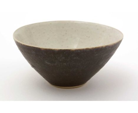 Dame Lucie Rie (1902-1995). A conical stoneware bowl with matte chocolate glazed exterior and oatmeal interior glaze, impress