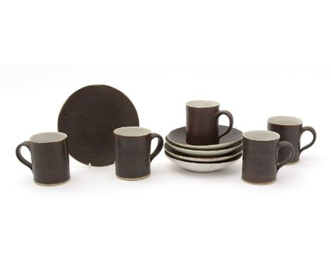Dame Lucie Rie (1902-1995). A set of five porcelain coffee cans and saucers, matte chocolate brown glazes, each piece with im