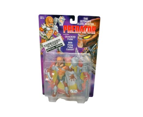 Kenner Action Figures comprising Predator Crasked Tusk Figure. Factory sealed on very good card.