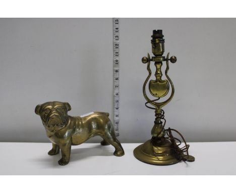 A heavy brass Bulldog and brass wall mounted lamp with gimble feature 