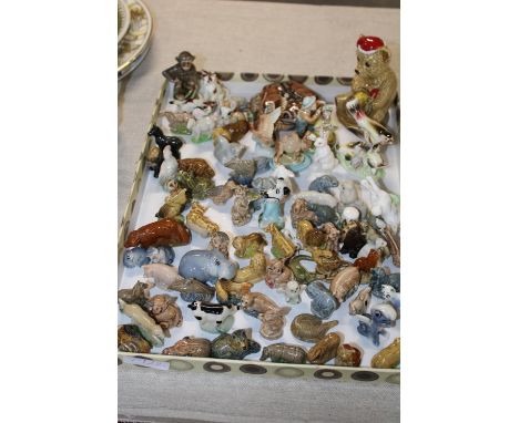 A job lot of assorted pottery figures mostly Wade Whimsies 